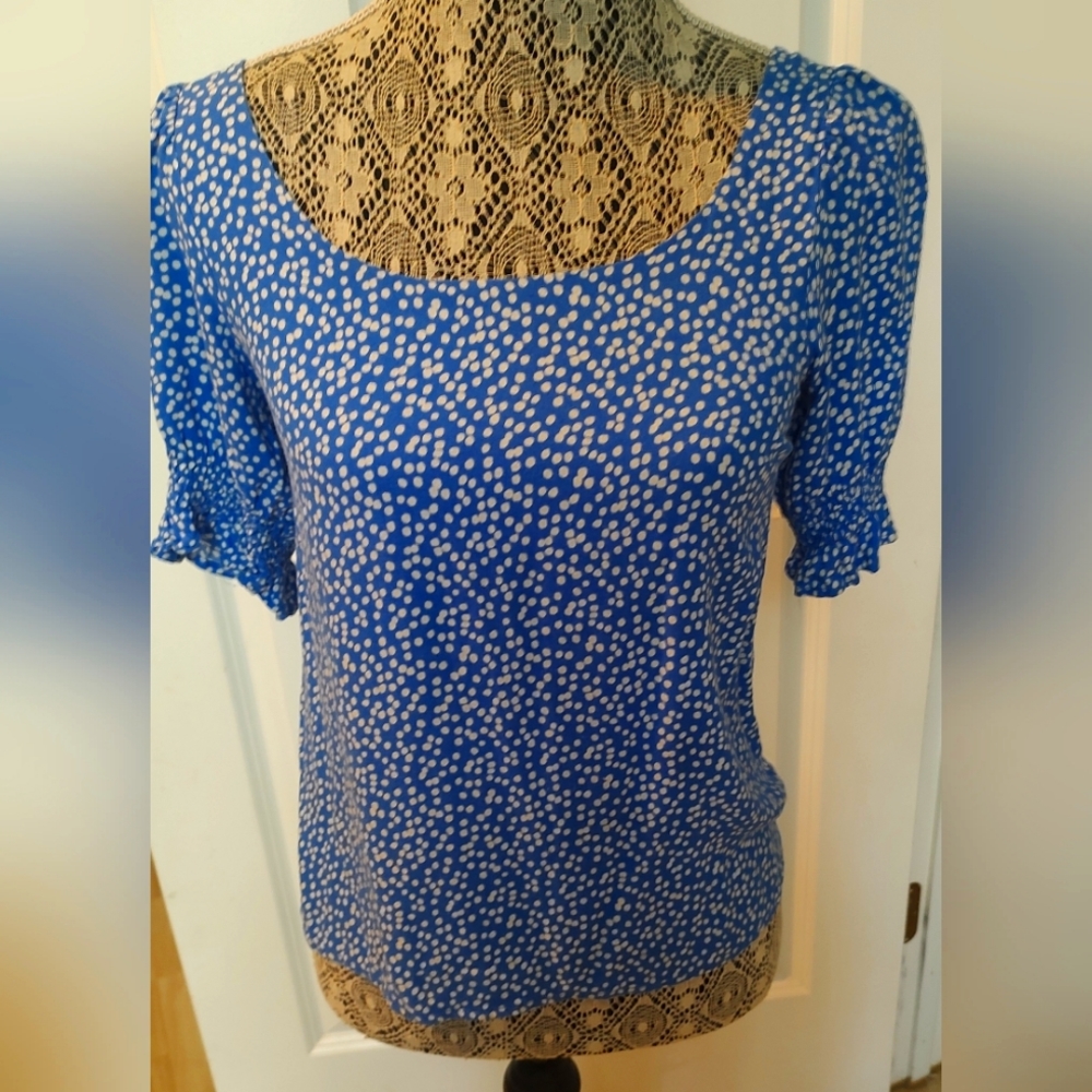Urban Romantics Blouse blue with white dots and a tie back, size small